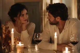signs someone is your soulmate shown by a couple sharing a quiet knowing look across a candlelit table